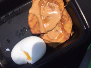 A GAPS Meal: butternut squash pancakes, topped with honey and peanut butter and a soft boiled egg